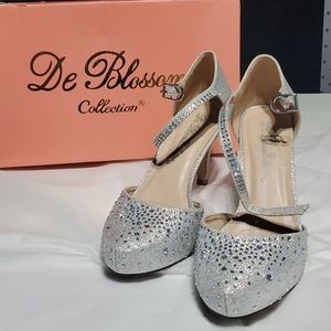 De Blossom sparkly, silver shoes.